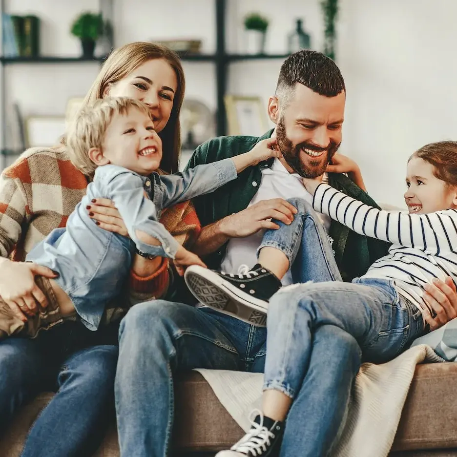 happy family on couch smiling